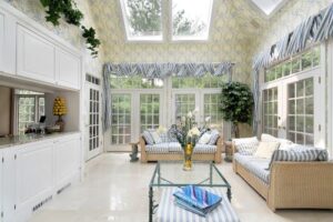 interior of a sunroom with comfy furnishings